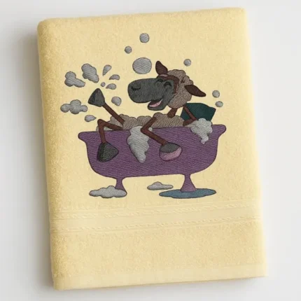 Cream kids bath towel with cartoon sheep splashing in a purple bathtub embroidered design