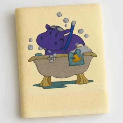 Cream cotton towel with cartoon hippo taking a bubbly bath embroidered design