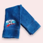 Blue towel with football embroidery and red, white and blue brush stroke accents