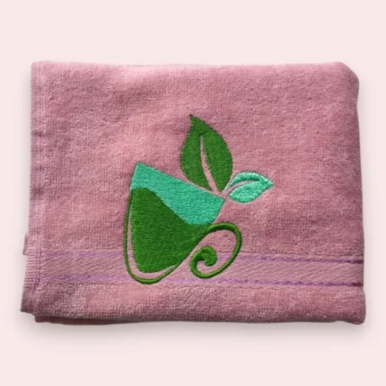 Pink cotton towel with green tea cup and leaf embroidery design