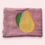 Pink cotton towel with embroidered yellow pear and green leaf design
