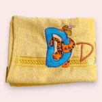 Yellow kids towel with embroidered Winnie style D monogram and tiger character
